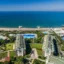 Stunning beachfront at Voyage Belek Golf & Spa with sun loungers and umbrellas