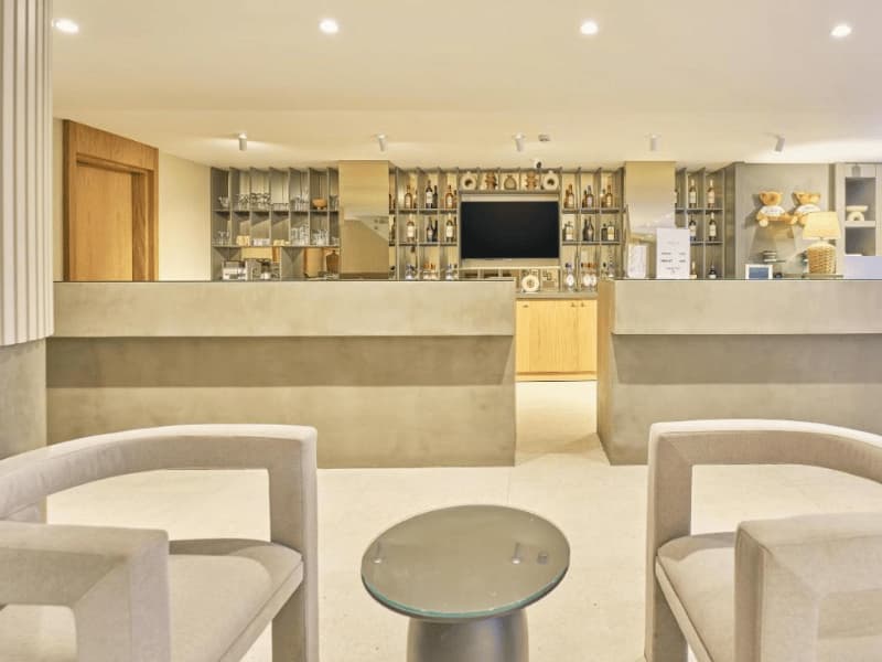 Elegant and welcoming reception area at La Maja Hotel Antalya, featuring modern decor, comfortable seating, and a well-stocked bar