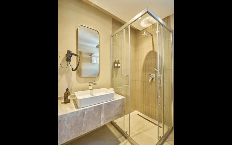 Modern bathroom with glass-enclosed shower and stylish vanity at La Maja Hotel Antalya