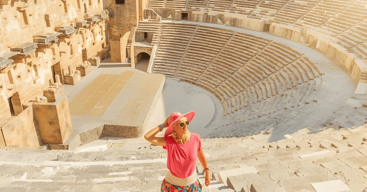 Ancient City Aspendos Antalya- tourist-girl-visiting-roman-theatre aspendos