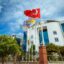 Outside view of Onkel Rada Apartment in Antalya for rent with Turkish flag and modern architecture