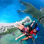 Paragliding Prices Oludeniz Turkey | It Deserves the Spotlight 6 Tandem paragliding over Oludeniz, Turkey, showcasing the Blue Lagoon and coastline – explore paragliding Oludeniz Turkey prices starting at $150 with Antalya Activities